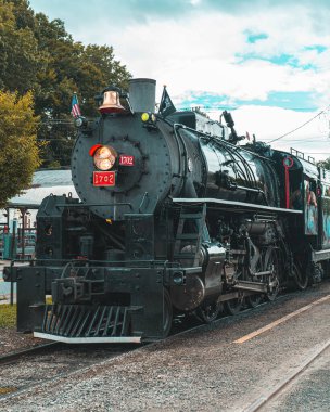 Steam train. Great Smoky Mountains Railroad or railway. North Carolina Mountains. Scenic view. Good for travel agency or posters.
