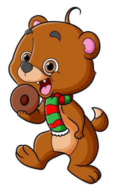 Ayı resimde dururken lezzetli çörekler yiyor.