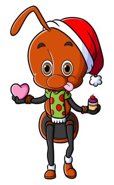 Mutlu karınca kalbi ve küçük bir resimli kek tutuyor.