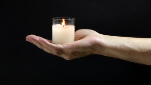 Christmas Candle Hand Hand Men Glows Candle Memory Background Black — Stock Video