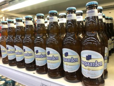 7.07.2022 Ukraine, Kharkiv, a shelf in a supermarket with beer in glass bottles