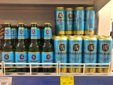 14.08.2022 Ukraine, Kharkiv, shelf with beer in glass bottles and cans