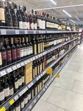 19.08.2022, Ukraine, Kharkiv, a large selection of wines of different varieties on the supermarket shelf