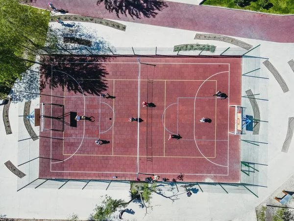 Volleyball. People play volleyball on the playground. Aerial view.