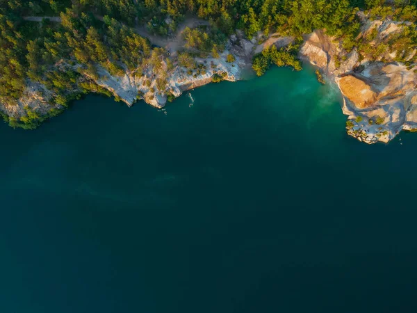 Career. Water-filled granite quarry. Aerial view.