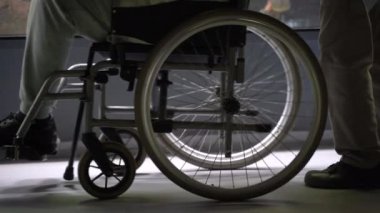 Disabled carriage. Grandpa in a wheelchair.