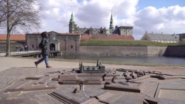 Travel. A woman walks in Denmark.