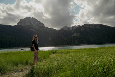 Skadar lake. The girl is standing near Skadar Lake.
