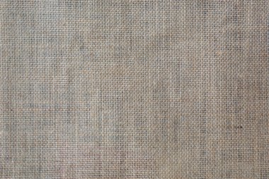 Gri çuval bezi malzemesinden yapılmış arka plan. Metin için boş alan.