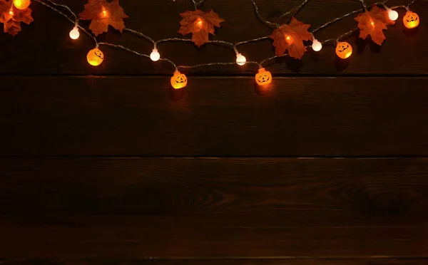 Glowing Garlands Halloween Pumpkin Lamps Leaves Dark Wooden Background Banner — Stock Photo, Image