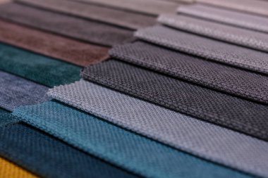 Mobilya kumaşı örnekleri. Çok renkli kumaş dokusu arka planı..