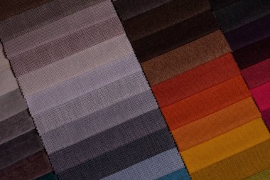 Mobilya kumaşı örnekleri. Çok renkli kumaş dokusu arka planı..