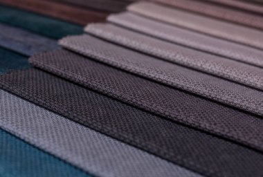 Mobilya kumaşı örnekleri. Çok renkli kumaş dokusu arka planı..