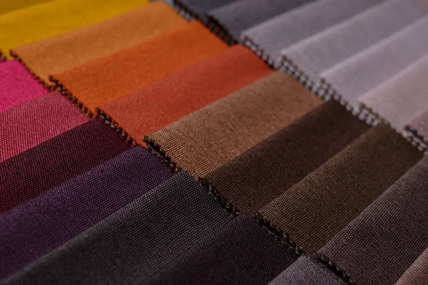 Mobilya kumaşı örnekleri. Çok renkli kumaş dokusu arka planı..