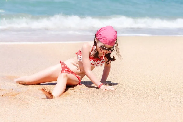 Happy Cute Girl Beach Backdrop Sea Ocean Buries Herself Sand — Fotografia de Stock