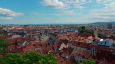 Aerial panorama view of Graz city old town from Castle Hill (Schlossberg) with historic buildings on a sunny summer day,  with blue sky cloud, Graz, Styria, Austria