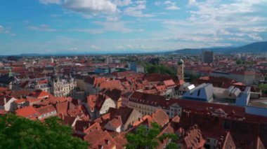 Aerial panorama view of Graz city old town from Castle Hill (Schlossberg) with historic buildings on a sunny summer day,  with blue sky cloud, Graz, Styria, Austria