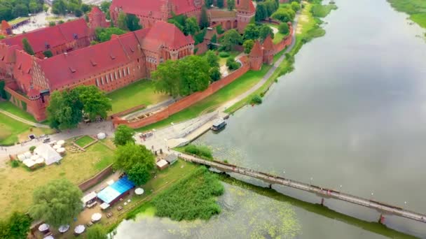 Malbork on the Nogat river the largest medieval brick castle from the bird's eye view — Stock Video