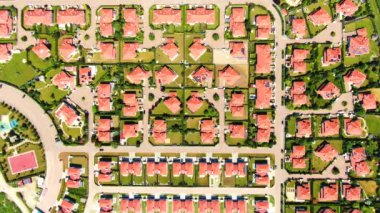 New development real estate. Aerial view of residential houses and driveways neighborhood during sunny day.Tightly packed homes.Top down view over private houses