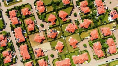 New development real estate. Aerial view of residential houses and driveways neighborhood during sunny day.Tightly packed homes.Top down view over private houses