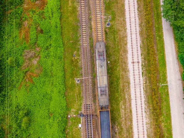 Aerial view of freight train wagons on large railway track field. Concept of modern logistics. Coal delivery