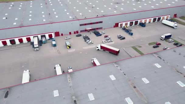 Aerial View Semi Trucks Cargo Trailers Standing Warehouses Ramps Loading — Video