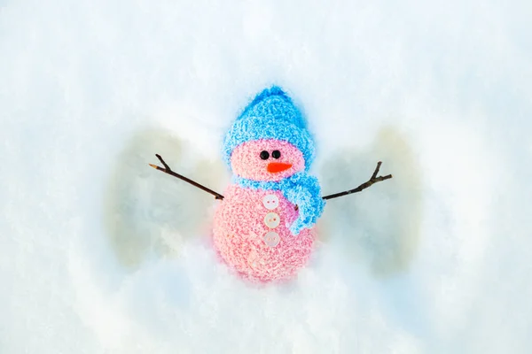 Cute Snowman Makes Snow Angel Winter Background Copy Space — Stockfoto