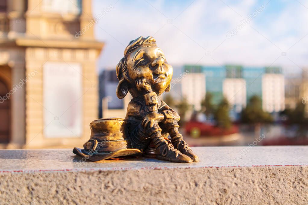 Miniature bronze statuette of a homlin outside the Museum of Fine Arts. Kaliningrad, Russia - January 17, 2022. 