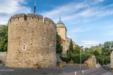 Summer view of the barbakan of Pecs, medieval circular defensive gate tower with loopholes, draw ridge, moat protecting the town from Turkish invasion 