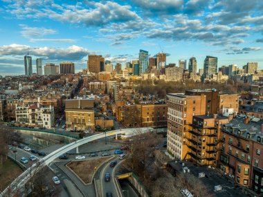 Aerial view of downtown Boston with dramatic blue cloudy sky