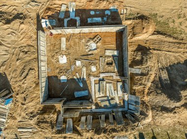 Aerial view of reinforced concrete foundation of a luxury single family house in a new American real estate development construction site