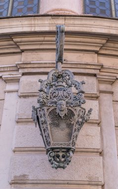 close up view of iron cast candelabra light in France