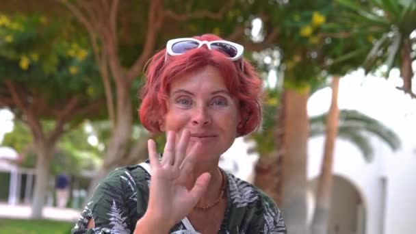 Cute senior woman on a videoo call — стоковое видео