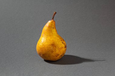 Minimalistic pear on grey background