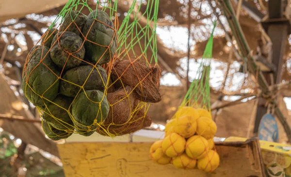Exotic fruits hanging at farmers market — Stock Photo, Image