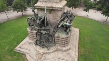 Circle drone view of monument at Rotunda da Boavista a foggy day. Porto, Portugal. 