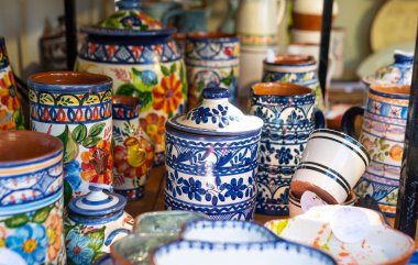 Stall with colorful Portuguese ceramics, traditional local handicrafts from Portugal.