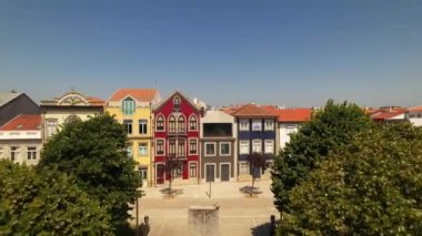 Aerial drone view of Traditional colorful Portuguese houses in Almada Square, Povoa de Varzim, Portugal. 