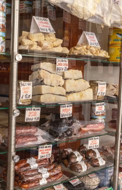 OPORTO, PORTUGAL - 28.07.2022: An assortment of bacalhau - traditional dried and salted cod and local sausages