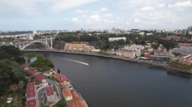 Aerial drone view of Porto Embankment over the river Douro and Arrabida white bridge 