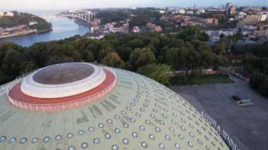 Circle Aerial view of The Crystal Palace near Douro river in the city center of Porto city, morning sunshine 