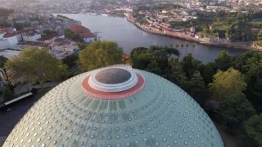 Circle Aerial view of The Crystal Palace near Douro river in the city center of Porto city, morning sunshine 