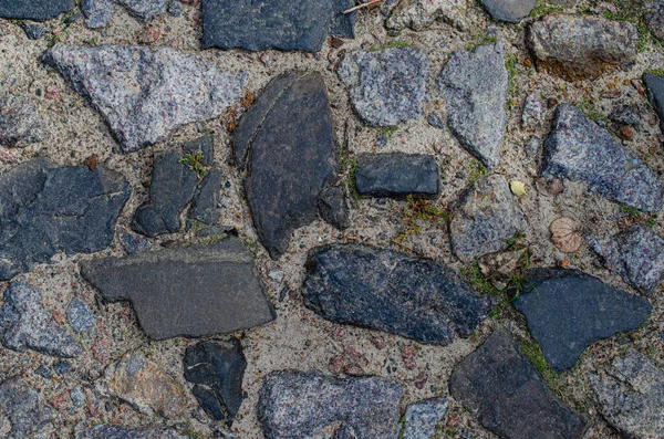 Block stone floor texture background Stone block road pavement. detail of cobblestone path ,grunge granite wall texture