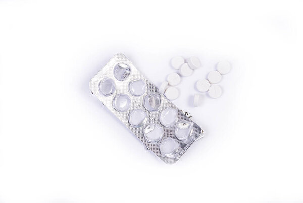 Medical blister from pills on an isolated white background with reflection capsule pills in blister on a white