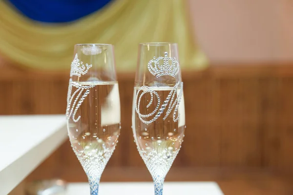 wedding glasses with sparkling wine om the table two glasses