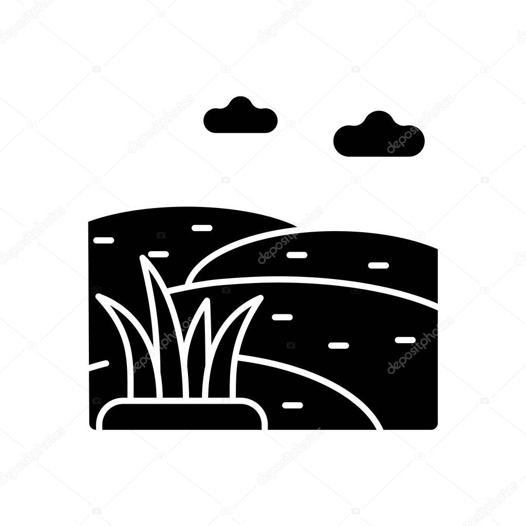 Grassland black glyph icon. Grass covered ground. Land with short vegetation growing. Large open grassy field. Animal grazing meadow. Silhouette symbol on white space. Vector isolated illustration