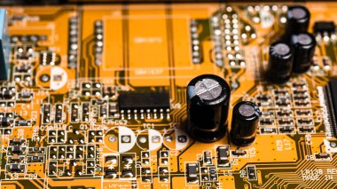 Computer electronic board with details, yellow, close-up