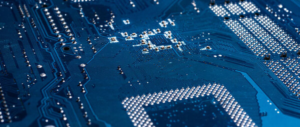 Electronic circuit board, blue color, selective focus, close-up