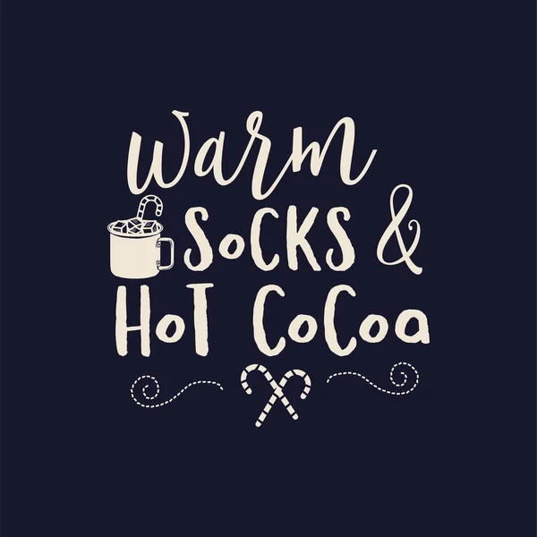 Merry Christmas lettering design on dark background. Holidays quote - warm sock and hot cocoa. Stock Christmas typography and calligraphy arts for t-shirt printing.