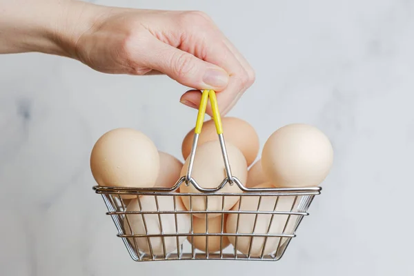 Woman Hand Holds Metal Shopping Basket Large Chicken Eggs Farm — стоковое фото
